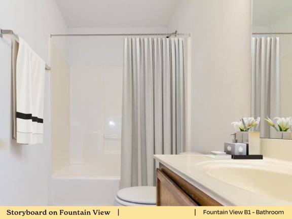 a bathroom with a sink and a tub and a shower