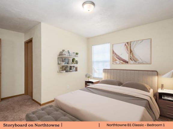 A bedroom with a bed, nightstand, and a framed picture on the wall.