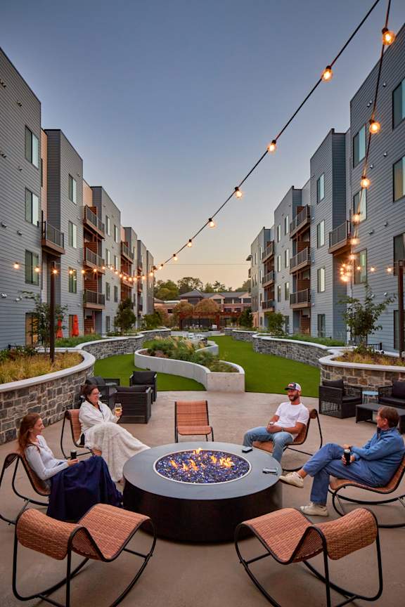 Courtyard Deck with Loungers and Daybeds at Clove Apartments, Omaha, 68114