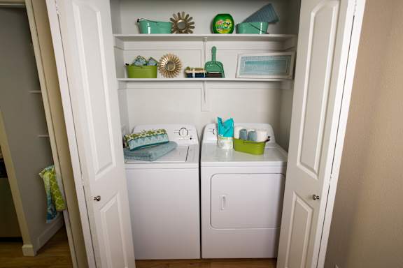 Model home laundry room and shelves at Abby Creek Apartments, California, 95608