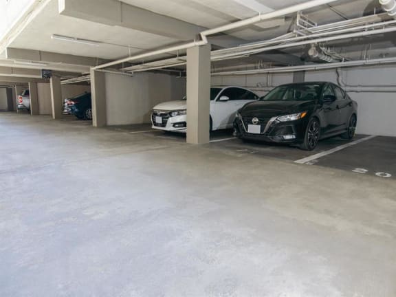 470 Apts parking garage with cars parked in it