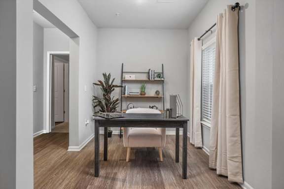 A room with a desk and a chair.