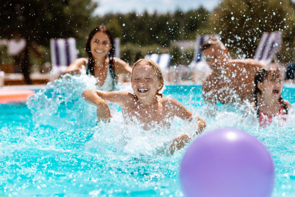 Children Splashing in a pool
