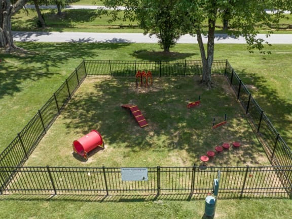 an aerial view of a dog park with a dog kennel and playground equipment at Stonewater Apartments, Louisville, 40241