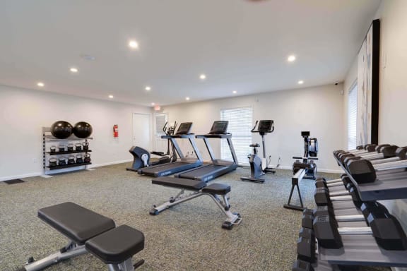a gym with treadmills and other exercise equipment at Station JTown, Kentucky, 40299