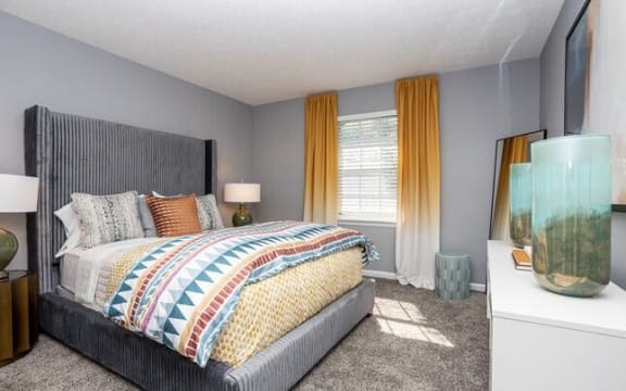 a bedroom with a bed and a large window at at Station JTown, Kentucky, 40299