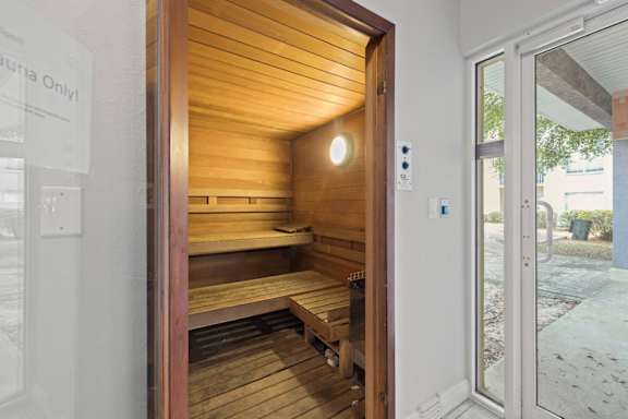 A sauna with wooden walls at Coastline Apartments, Florida