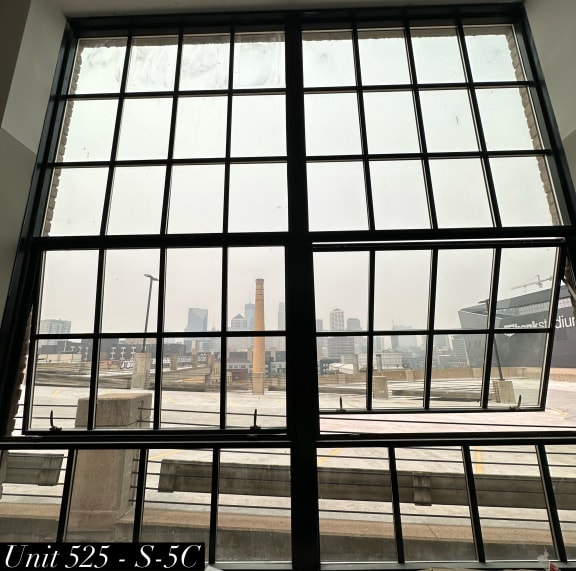 a view of the city from inside the building