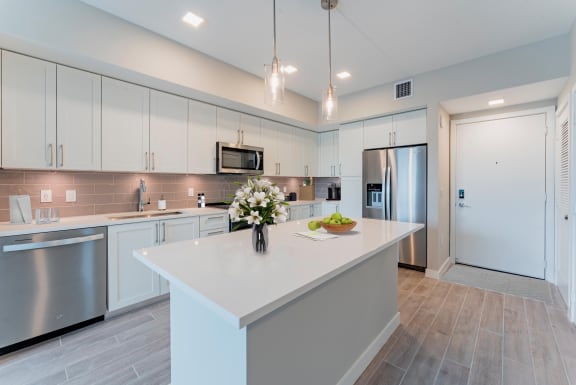 Kitchen with White Cabinets at Mayla Pompano, Pompano Beach, 33062
