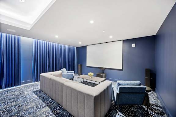 Modern bedroom with a large bed at Hudson Piers, Yonkers, NY 10701