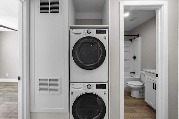 a small laundry room with a washing machine and a dryer at Ocean Breeze Terrace Apartment, California