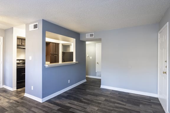 A room with a window and a door.