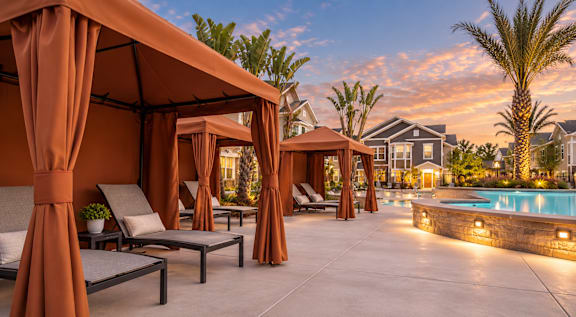 A poolside area with lounge chairs and umbrellas.
