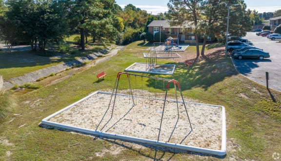 a playground in a park on a sunny day