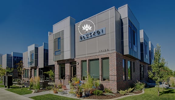 A modern building with a Pei-designed logo on the front.