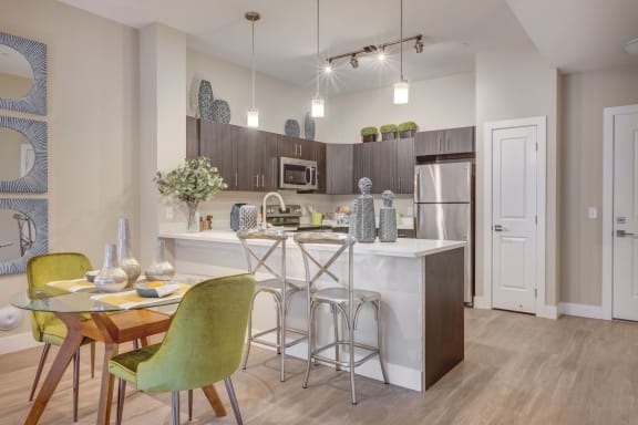 kitchen and dining area at the bradley braddock road station apartments