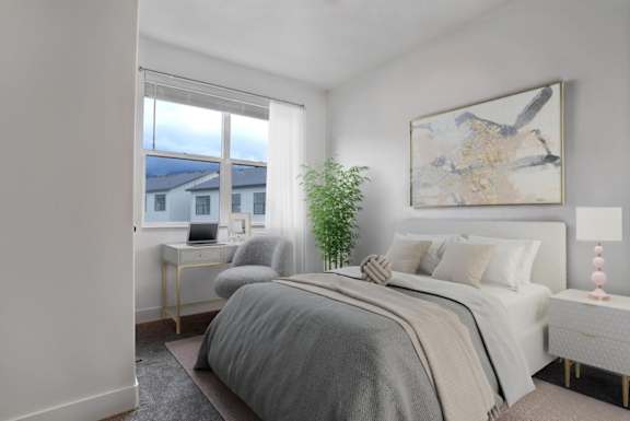 A bedroom with a large bed and a painting on the wall.