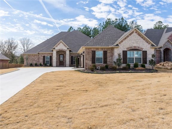 a house with a large yard in front of it