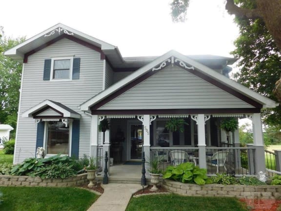 a house with a porch and a porch swing