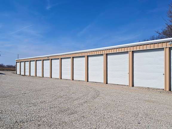 A long row of closed grey garage doors.