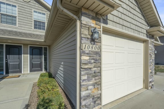 the front of a house with a garage door