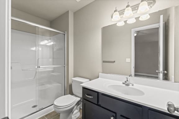the preserve at ballantyne commons bathroom with sink toilet and shower