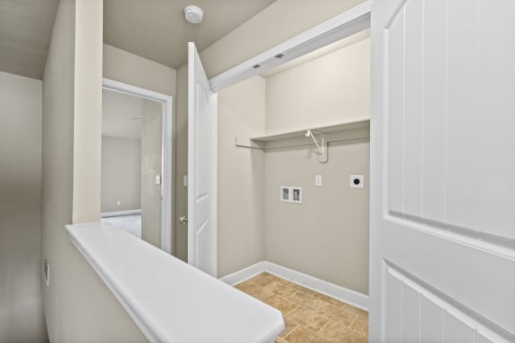 a bathroom with a white tub and a walk in closet