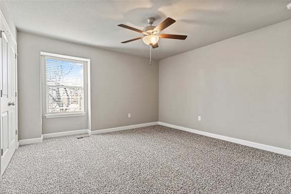 A room with a ceiling fan and a window with blinds.