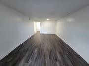 A long hallway with a light at the end.