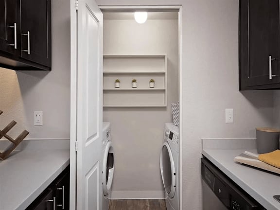 A laundry room with a washer and dryer in it.