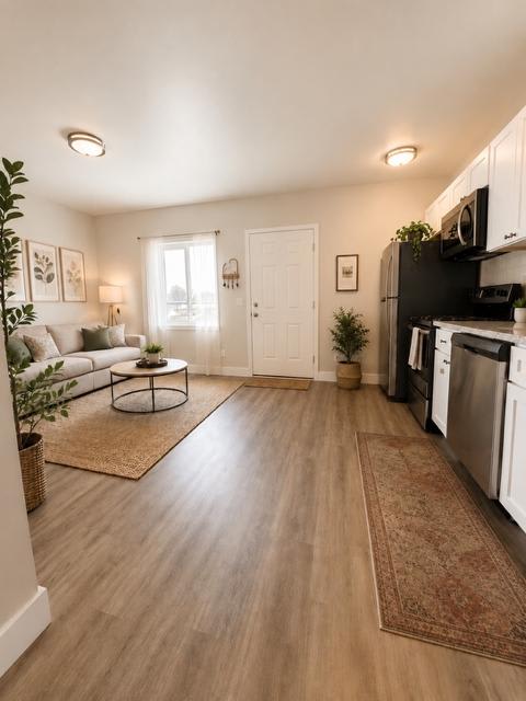 Floor Plan  A kitchen with a white door and a white couch.