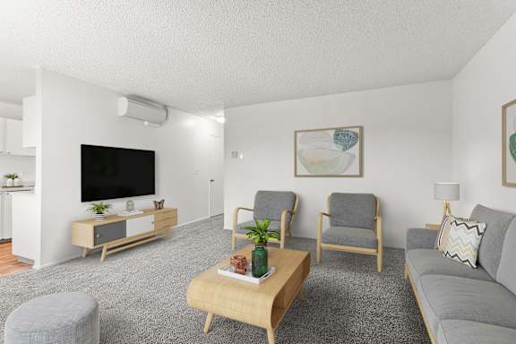 Living room with a grey carpet at Garden Villa Apartments, Portland, Oregon