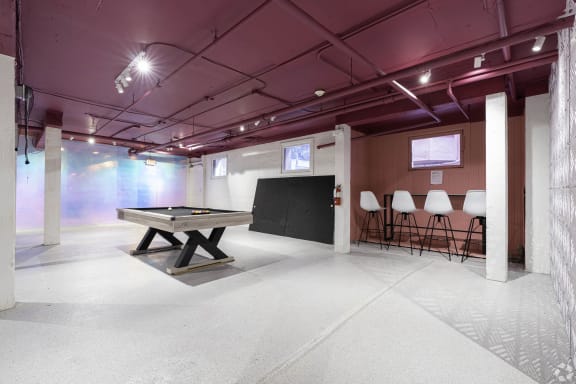 a room with a pool table and a chalkboard in the middle at Clay & Tiffany, Portland, 97201
