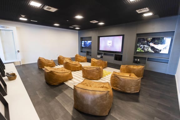 a large conference room with couches and televisions at Moraine, Tacoma, WA
