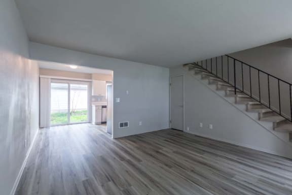 a room with a staircase and a door