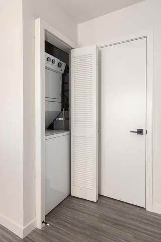 Floor Plan  a white kitchen with a white door and a white refrigerator