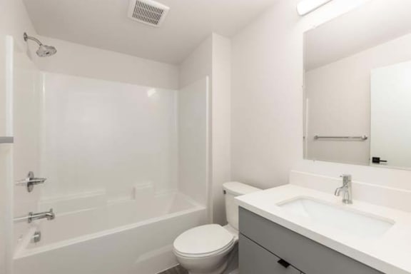 a bathroom with a toilet sink and bathtub