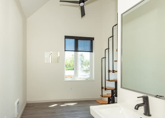 A bathroom with a window and a sink at Society 62 Apartments, Portland, OR