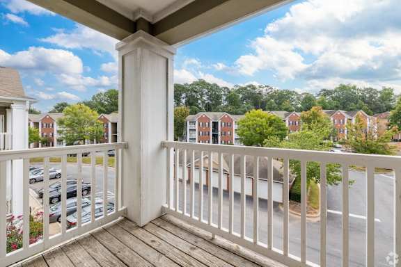 the view from the balcony of a home with a balcony railing at Magnolia Lake Apartments, Georgia 30117