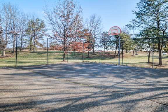 A basketball court with a red circle and a line through it at The Regency Apartment Homes, Manassas, VA