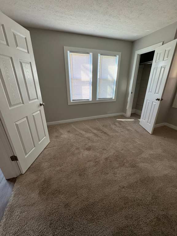 A white door with a window above it.