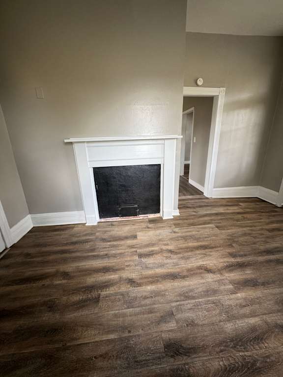 A window in a room with a wooden wall.