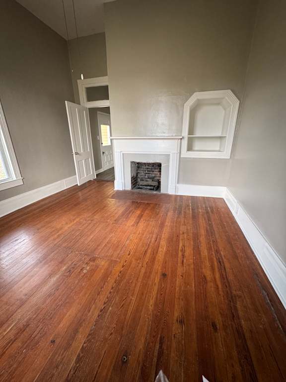 A room with a wooden wall and a white ceiling.