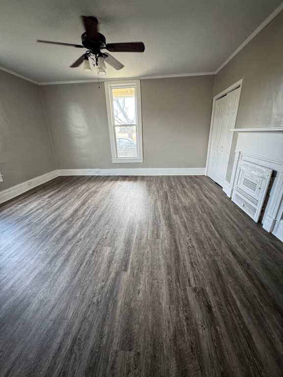 A room with a ceiling fan and a window.