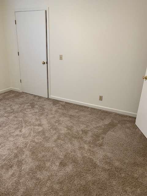 a room with a closet and a wall with a door