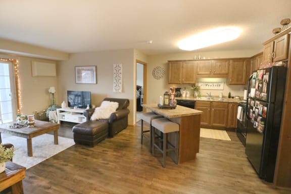 an open living room and kitchen with a table and chairs at Boulder Ridge, Duluth, 55811