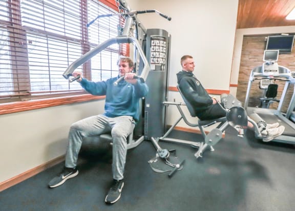 a group of men in a gym exercising on machines at Summit Ridge, Minnesota, 55811
