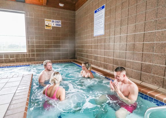 a group of people playing in a swimming poo at Summit Ridge, Duluth, MN, 55811l