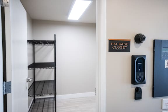 Storage room with shelving units and open floor space at Heartland Flats Alliance.