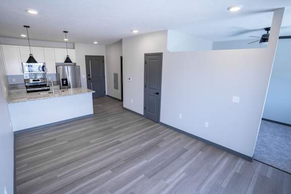 Living area with wood style flooring and open layout at The Harbor